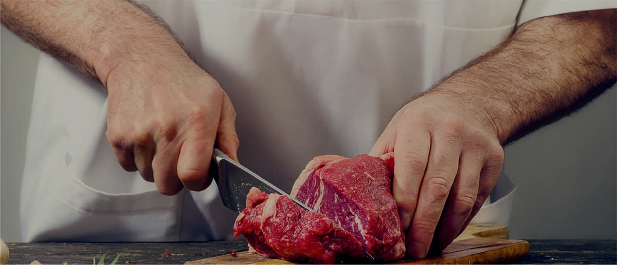 Butcher at work at Siesel's Meats